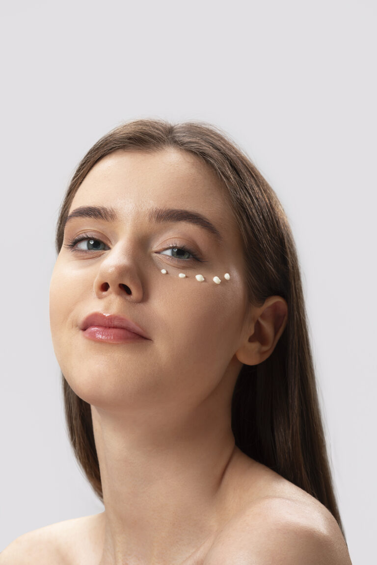 Woman prepping for eye filler treatment