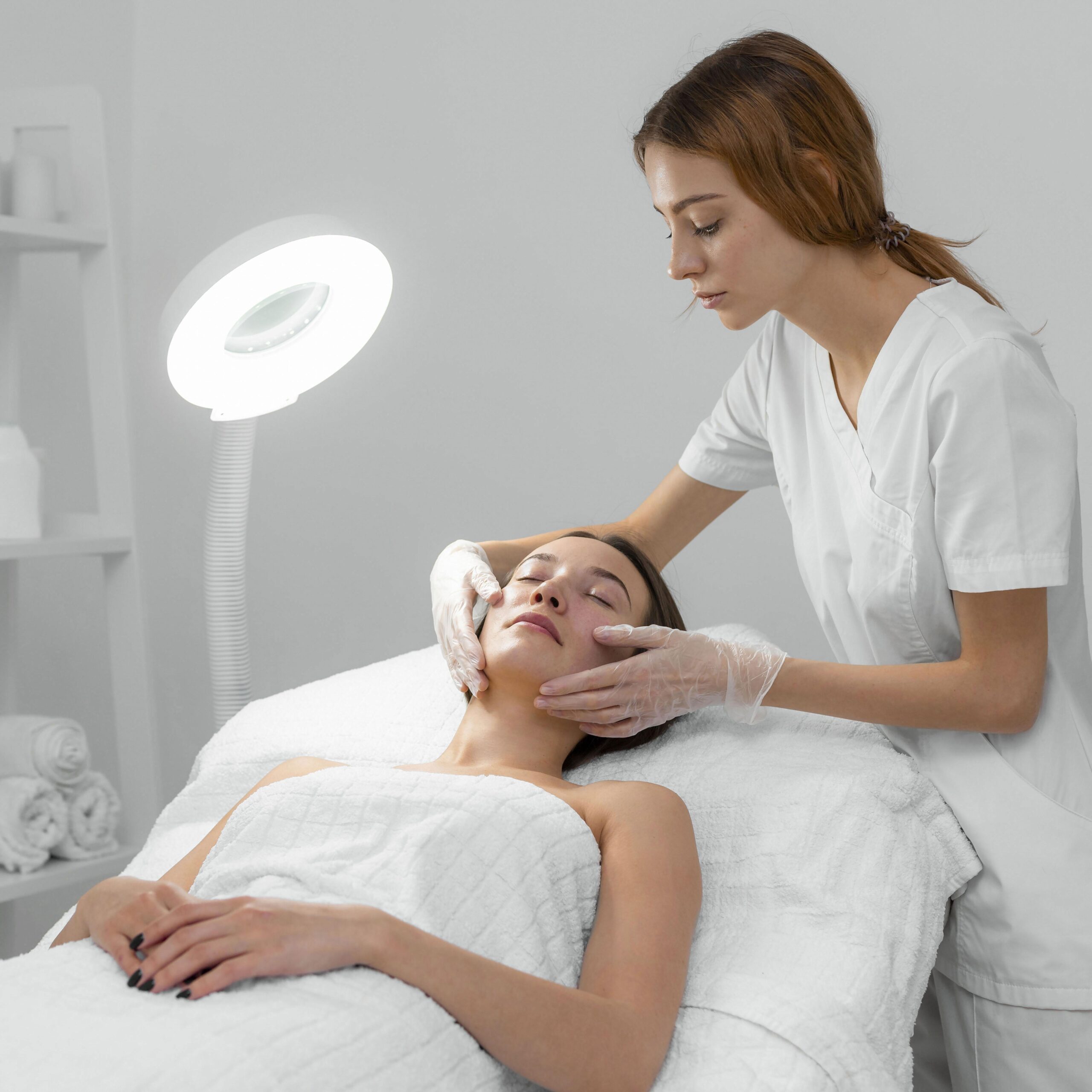 Med spa professional making a facial treatment